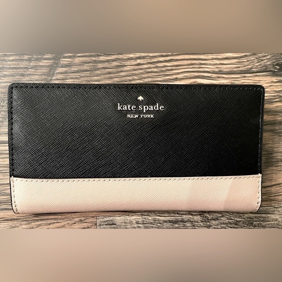 kate spade Handbags - SOLD NOT FOR SALE! Like new Kate Spade Slim Bi-Fold Wallet